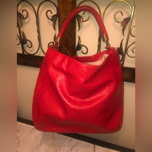 Red faux leather ostrich; light beige inside; cute & very classy